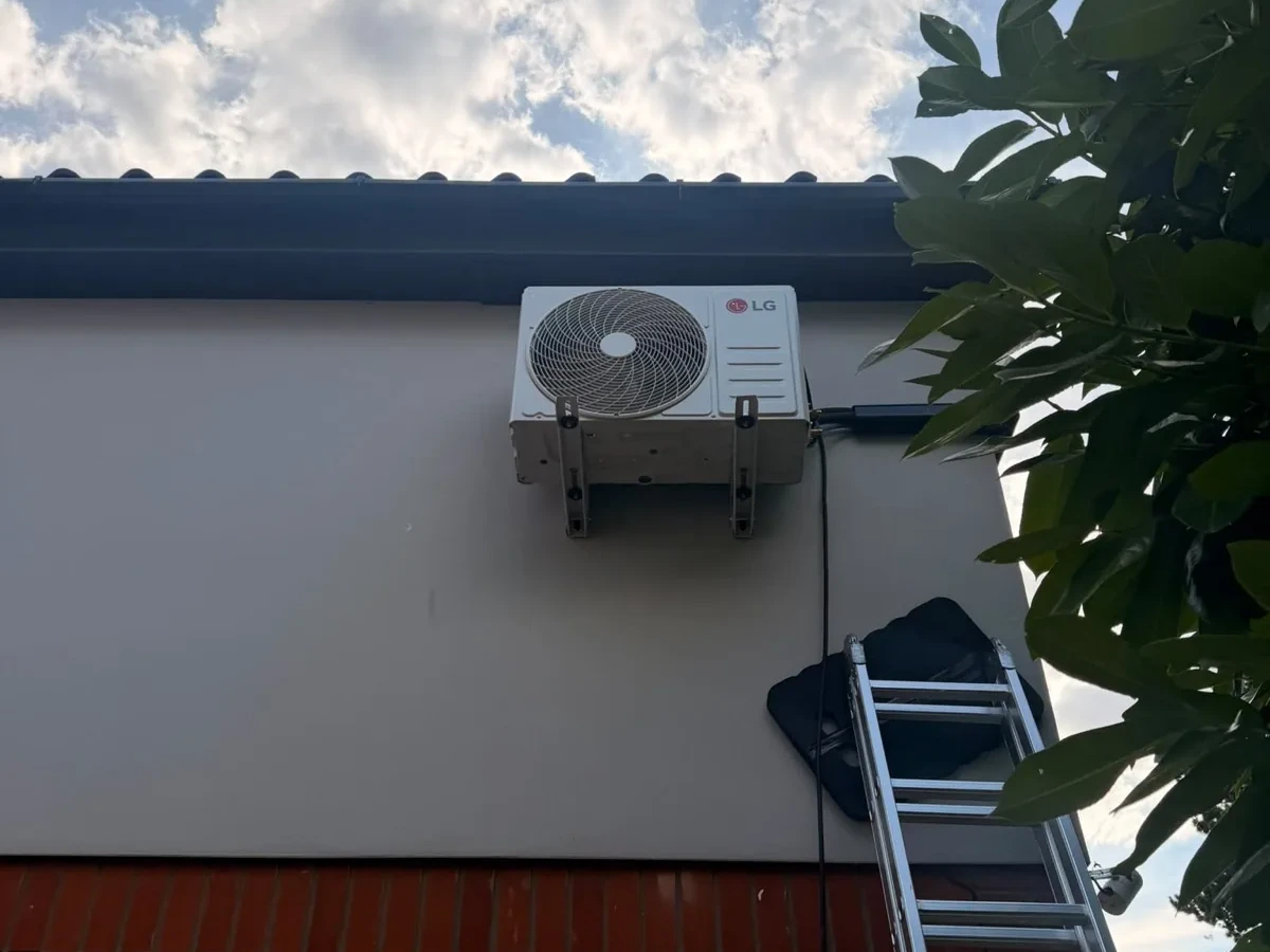 Close view of a ceiling cassette air conditioning grille after fitting by Perennia Climate Services