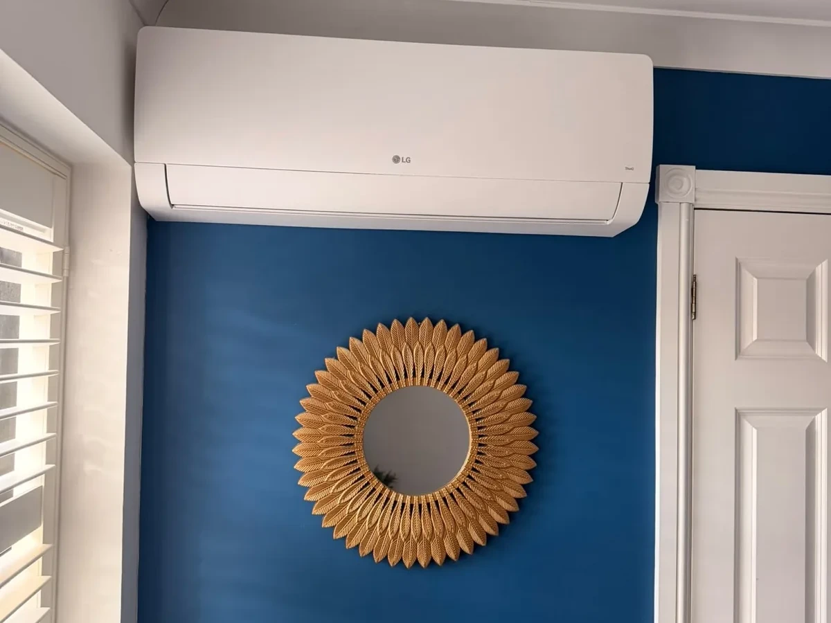 Open ceiling cassette air conditioning unit during installation by Perennia Climate Services